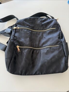 Black Nylon Backpack with Gold Zippers with slight camouflage detail